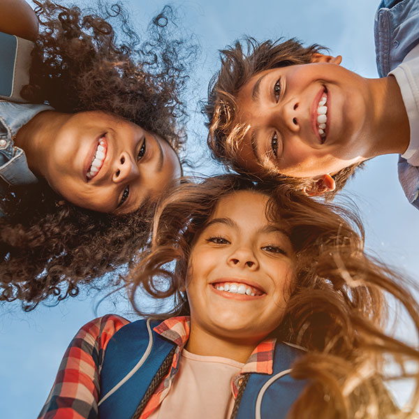 Three Children Looking Down at the Camera Three Children Looking Down at the Camera